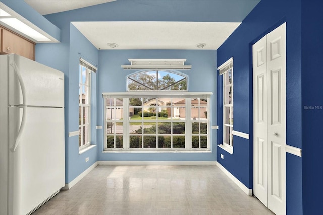 10935 New Brighton Ct, New Port Richey, FL 34654 - unfurnished dining area with baseboards