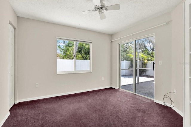 10935 New Brighton Ct, New Port Richey, FL 34654 - spare room with dark carpet, a textured ceiling, and ceiling fan