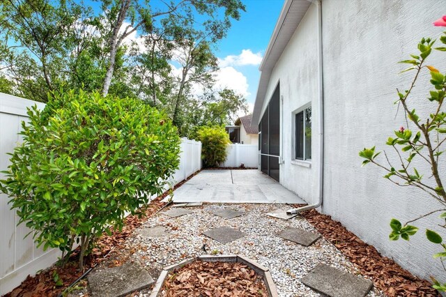 10935 New Brighton Ct, New Port Richey, FL 34654 - fenced backyard featuring a patio