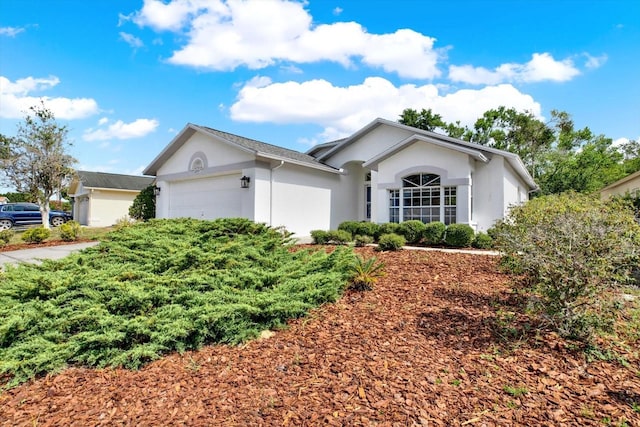 10935 New Brighton Ct, New Port Richey, FL 34654 - ranch-style house featuring stucco siding and an attached garage