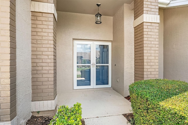 1415 Pinewood Hills Ct, Spring Hill, FL 34606 - entrance to property featuring stucco siding and french doors