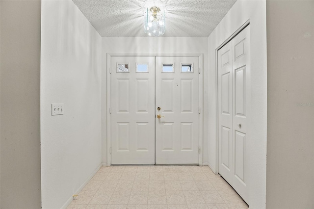 1415 Pinewood Hills Ct, Spring Hill, FL 34606 - foyer featuring a textured ceiling and baseboards
