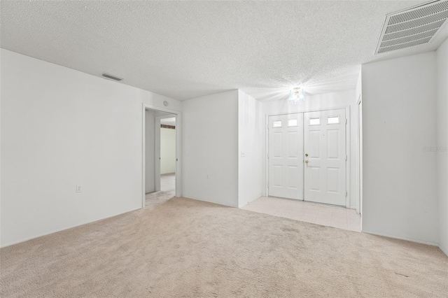 1415 Pinewood Hills Ct, Spring Hill, FL 34606 - carpeted spare room with a textured ceiling