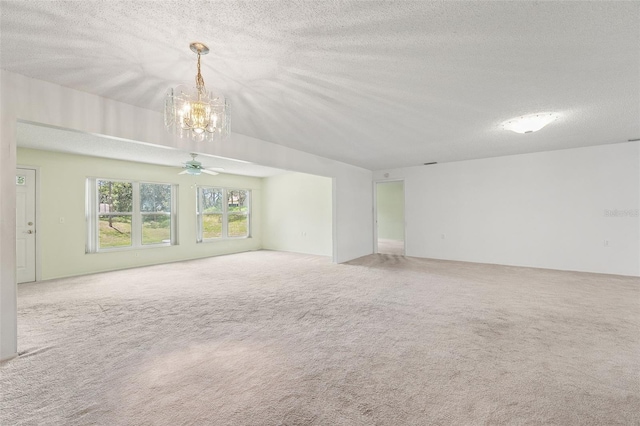 1415 Pinewood Hills Ct, Spring Hill, FL 34606 - carpeted spare room featuring a chandelier, a textured ceiling, and ceiling fan