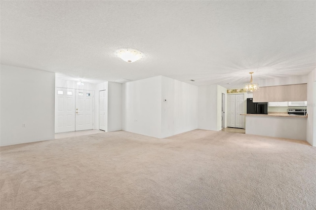 1415 Pinewood Hills Ct, Spring Hill, FL 34606 - unfurnished living room featuring a chandelier, light colored carpet, and a textured ceiling