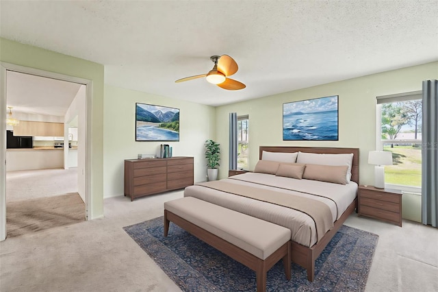 1415 Pinewood Hills Ct, Spring Hill, FL 34606 - bedroom with light carpet, multiple windows, freestanding refrigerator, and a ceiling fan