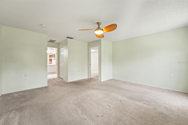 1415 Pinewood Hills Ct, Spring Hill, FL 34606 - spare room with carpet flooring, ceiling fan, a textured ceiling, and a smoke detector