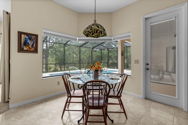 64 Cypress Blvd E, Homosassa, FL 34446 - dining room featuring baseboards, light tile patterned floors, and a sunroom