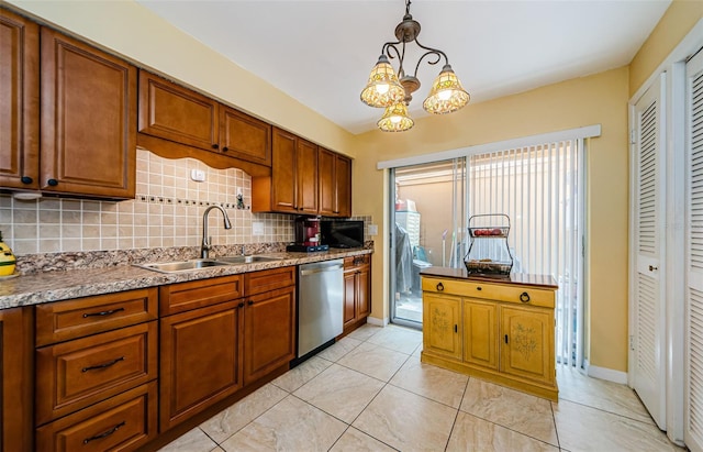 3841 Lanyard Ct Unit B, New Port Richey, FL 34652 - kitchen featuring dishwasher, decorative backsplash, brown cabinetry, and decorative light fixtures