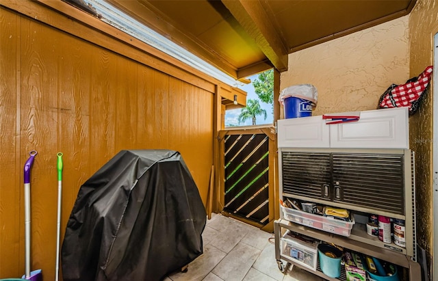 3841 Lanyard Ct Unit B, New Port Richey, FL 34652 - misc room featuring beam ceiling and light tile patterned floors