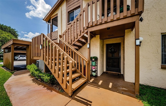 3841 Lanyard Ct Unit B, New Port Richey, FL 34652 - doorway to property featuring stucco siding