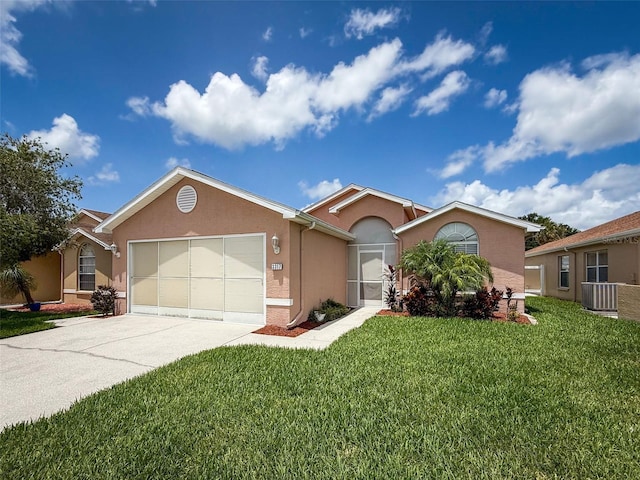 3317 Abigail Ct, New Port Richey, FL 34655 - single story home featuring stucco siding, a garage, driveway, and a front yard