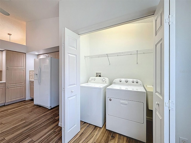 3317 Abigail Ct, New Port Richey, FL 34655 - laundry area with washing machine and clothes dryer and wood finished floors