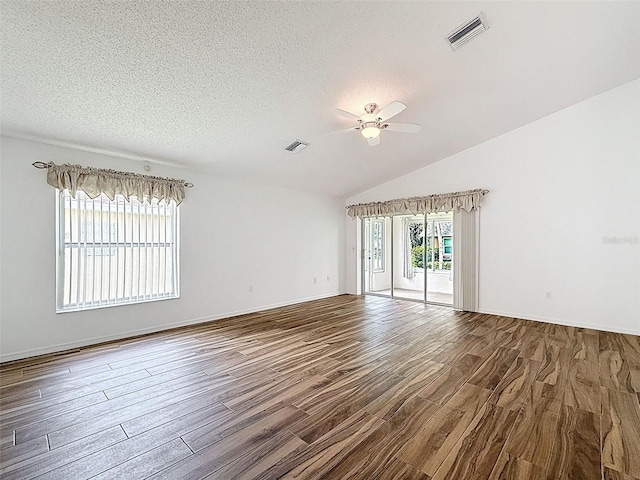 3317 Abigail Ct, New Port Richey, FL 34655 - unfurnished room featuring a ceiling fan, wood finished floors, a textured ceiling, and lofted ceiling