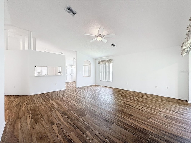 3317 Abigail Ct, New Port Richey, FL 34655 - unfurnished living room featuring ceiling fan, lofted ceiling, a textured ceiling, and wood finished floors
