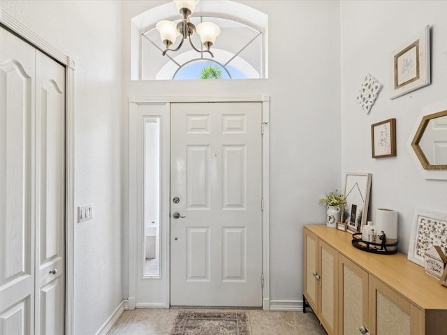 4716 Wolfram Ln, New Port Richey, FL 34653 - foyer entrance with a chandelier and baseboards