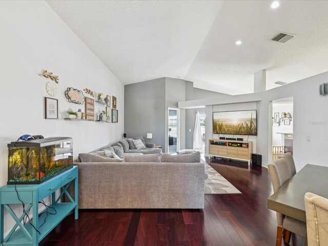 4716 Wolfram Ln, New Port Richey, FL 34653 - living room with vaulted ceiling, wood-type flooring, and recessed lighting