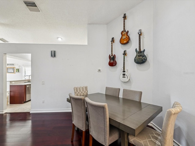 4716 Wolfram Ln, New Port Richey, FL 34653 - dining room featuring hardwood / wood-style flooring and baseboards