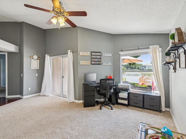4716 Wolfram Ln, New Port Richey, FL 34653 - office area featuring light carpet, a ceiling fan, a textured ceiling, and lofted ceiling