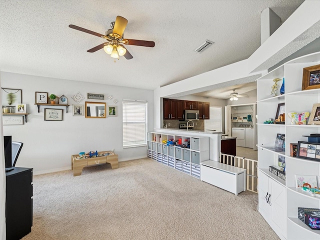 4716 Wolfram Ln, New Port Richey, FL 34653 - rec room featuring ceiling fan, light colored carpet, and a textured ceiling