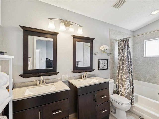 4716 Wolfram Ln, New Port Richey, FL 34653 - full bath with shower / bath combination with curtain, two vanities, and vaulted ceiling