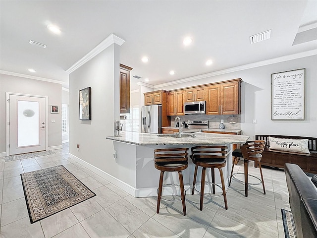 4082 Watson Dr, New Port Richey, FL 34655 - kitchen with stainless steel appliances, light stone countertops, a kitchen breakfast bar, crown molding, and backsplash
