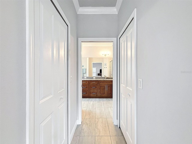 4082 Watson Dr, New Port Richey, FL 34655 - hallway featuring crown molding and a sink