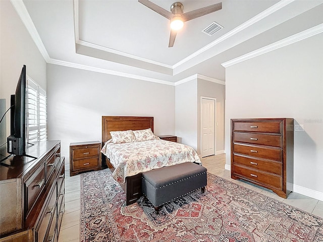 4082 Watson Dr, New Port Richey, FL 34655 - bedroom featuring a tray ceiling, light tile patterned floors, ornamental molding, and ceiling fan