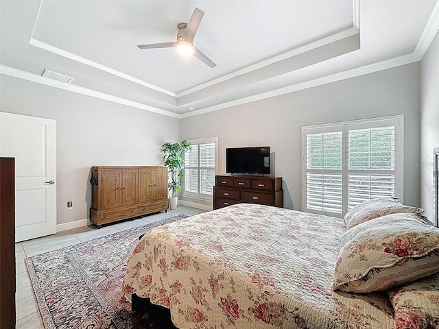 4082 Watson Dr, New Port Richey, FL 34655 - bedroom featuring a raised ceiling, crown molding, a ceiling fan, and light tile patterned flooring