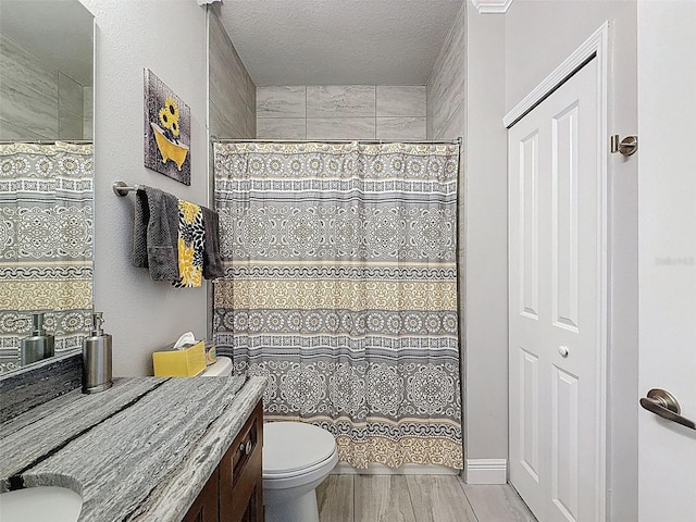 4082 Watson Dr, New Port Richey, FL 34655 - bathroom with vanity, a shower with shower curtain, a textured ceiling, and wood finished floors