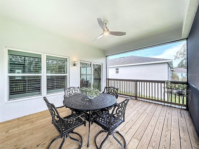 4082 Watson Dr, New Port Richey, FL 34655 - wooden deck with ceiling fan and outdoor dining space