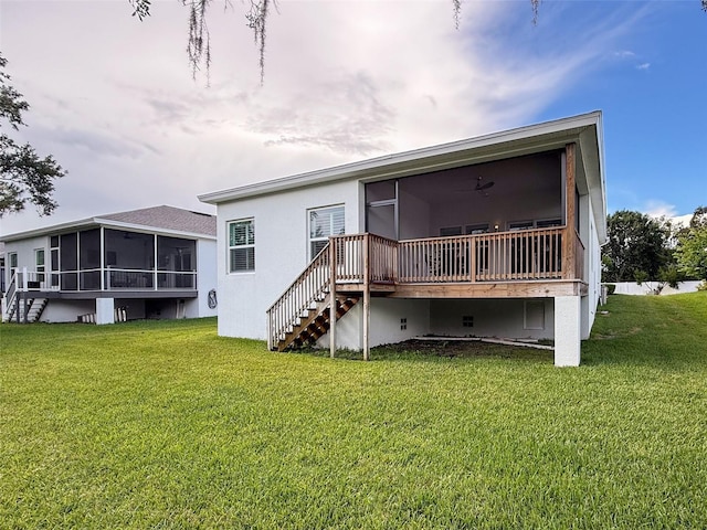 4082 Watson Dr, New Port Richey, FL 34655 - back of house featuring a sunroom, stairs, a yard, and stucco siding