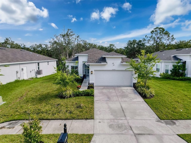 4082 Watson Dr, New Port Richey, FL 34655 - view of front of house with stucco siding, an attached garage, driveway, and a front lawn