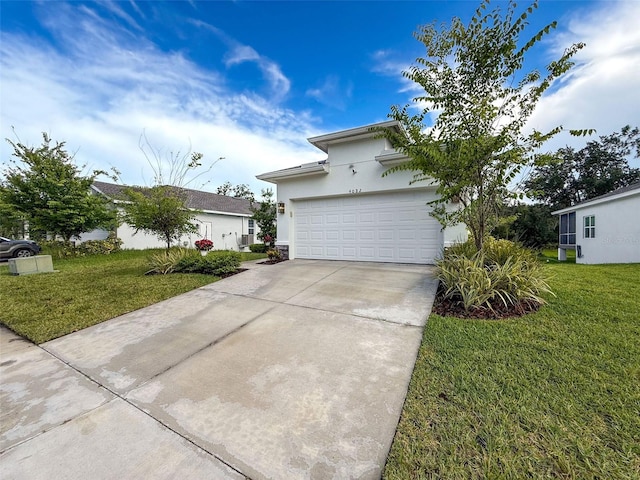 4082 Watson Dr, New Port Richey, FL 34655 - view of front of property with stucco siding, driveway, a front yard, and an attached garage