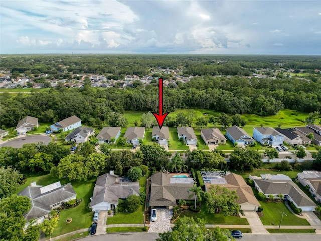 4082 Watson Dr, New Port Richey, FL 34655 - aerial overview of property's location featuring nearby suburban area and a forest