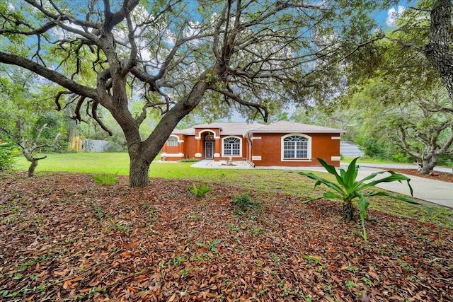 9130 Madrid Rd, Weeki Wachee, FL 34613 - single story home featuring stucco siding