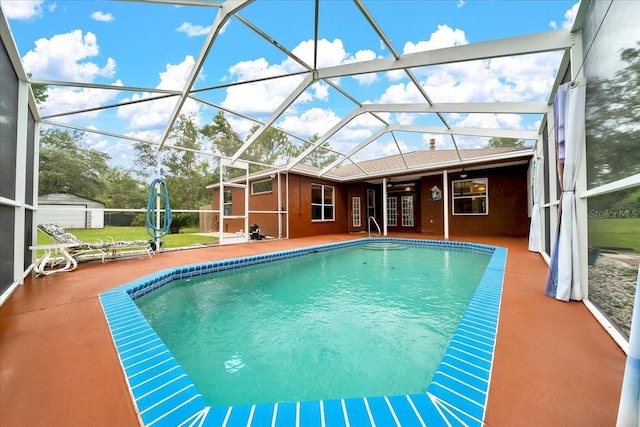 9130 Madrid Rd, Weeki Wachee, FL 34613 - outdoor pool featuring a patio area, glass enclosure, and french doors