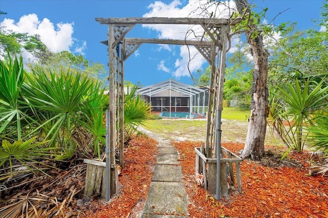 9130 Madrid Rd, Weeki Wachee, FL 34613 - view of yard with an outdoor pool and a lanai