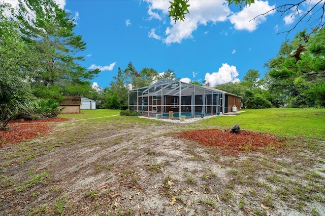 9130 Madrid Rd, Weeki Wachee, FL 34613 - rear view of property featuring a yard, a lanai, and a swimming pool