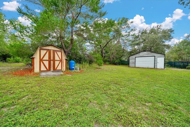 9130 Madrid Rd, Weeki Wachee, FL 34613 - view of grassy yard featuring a shed and a detached garage