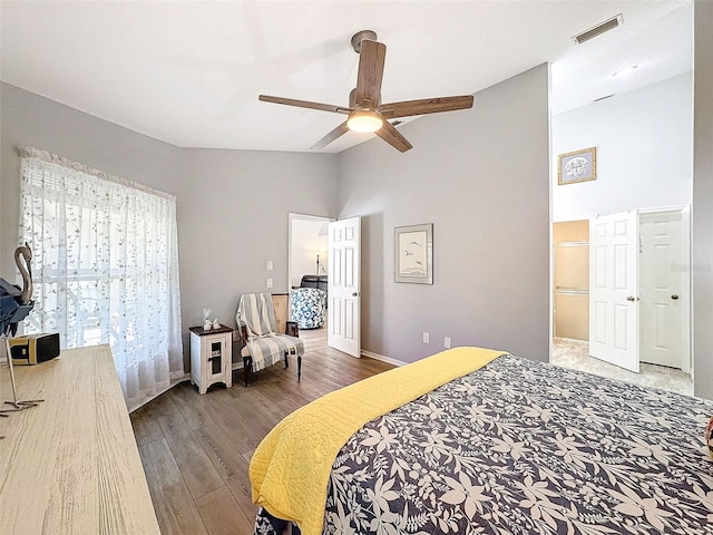 7518 Mediterranean Ct, Hudson, FL 34667 - bedroom with wood finished floors, high vaulted ceiling, and a ceiling fan