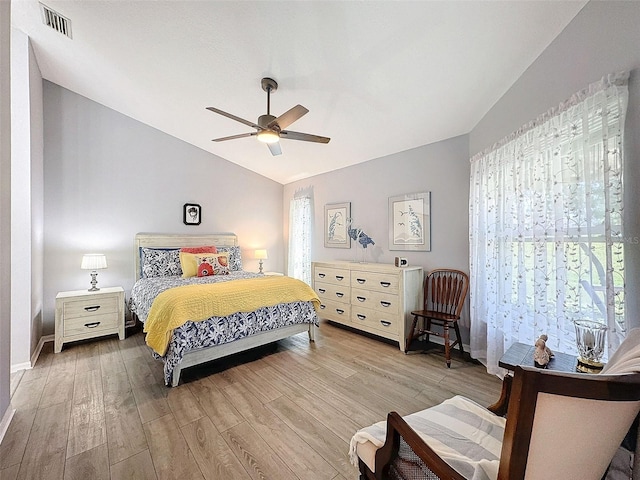 7518 Mediterranean Ct, Hudson, FL 34667 - bedroom featuring vaulted ceiling, wood finished floors, and a ceiling fan