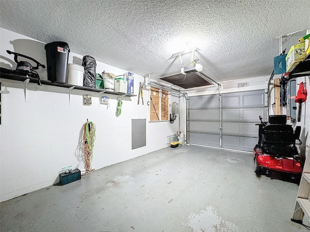 7518 Mediterranean Ct, Hudson, FL 34667 - garage featuring a garage door opener and concrete block wall