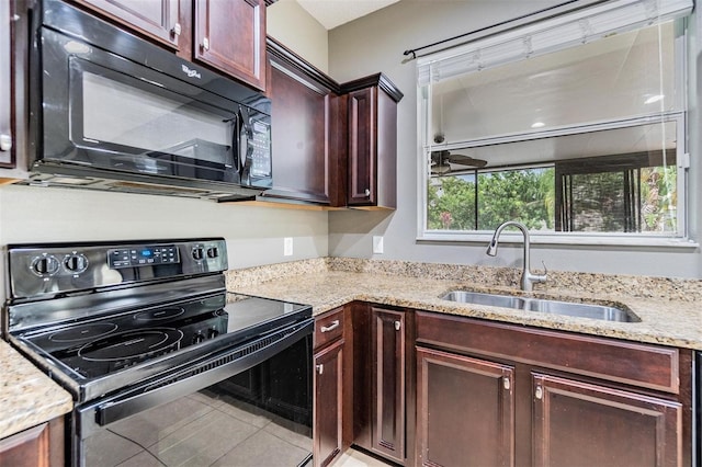 1104 Ketzal Dr, Trinity, FL 34655 - kitchen featuring black appliances, light stone counters, and tile patterned floors