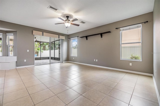 1104 Ketzal Dr, Trinity, FL 34655 - empty room with ceiling fan and light tile patterned floors
