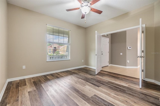 1104 Ketzal Dr, Trinity, FL 34655 - spare room featuring wood finished floors and ceiling fan