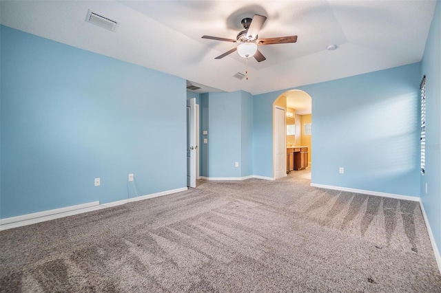 1104 Ketzal Dr, Trinity, FL 34655 - spare room featuring arched walkways, a ceiling fan, and light carpet