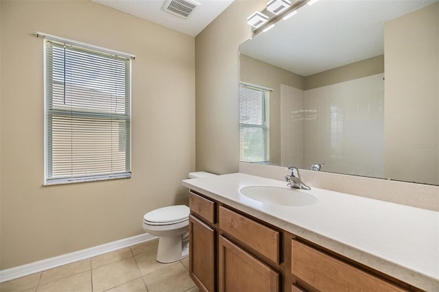 1104 Ketzal Dr, Trinity, FL 34655 - full bathroom featuring healthy amount of natural light, vanity, and tile patterned flooring