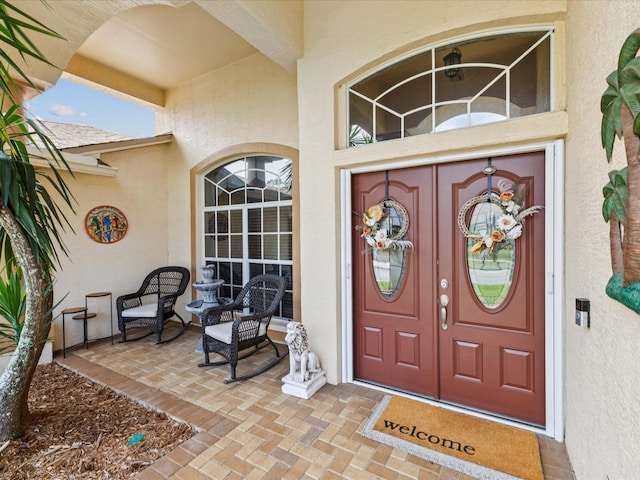 11144 Brambleleaf Way, Hudson, FL 34667 - view of exterior entry featuring stucco siding