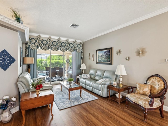 11144 Brambleleaf Way, Hudson, FL 34667 - living area featuring crown molding, wood finished floors, and a textured ceiling